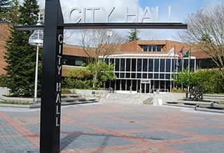 Auburn City Hall and its brick plaza with the City Hall sign